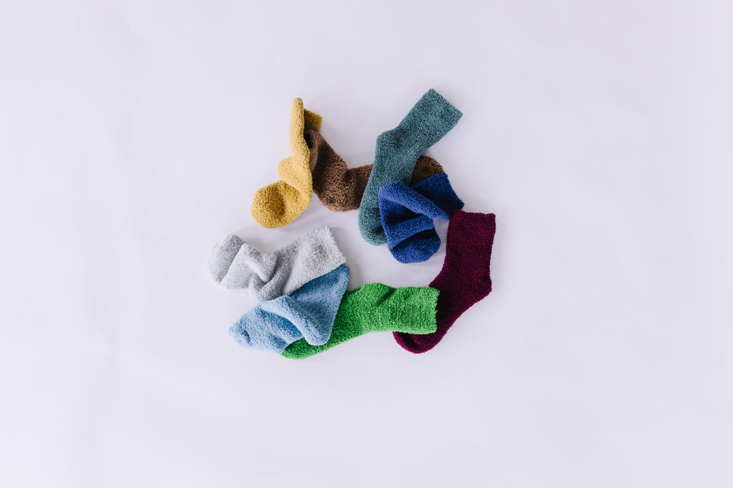 Night Sky | Dark Blue Cozy Socks, River | Natural Calm Blue Cozy Socks, Crops of Hops | Verdant Green Cozy Socks, Hazelnut | Crunchy Brown Cozy Socks, Sweet Feet | Honey Cozy Socks, Vineyard | Valley Harvest Purple Cozy Socks, Forest Trail | Peaceful Green Cozy Socks, Whale Watch | Bay Gray Cozy Socks | Fuzzy Socks | Cozy Socks for a Cause "laundry day" Group Picture for Hazelnut | Crunchy Brown Cozy Socks