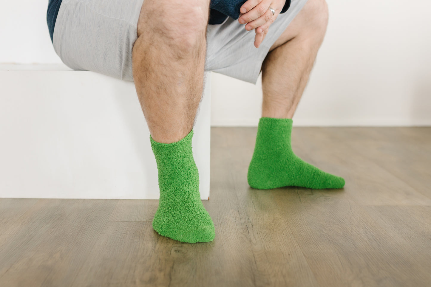 Crops of Hops | Verdant Green Cozy Socks | Fuzzy Socks | Cozy Socks for a Cause- on feet, sitting white step